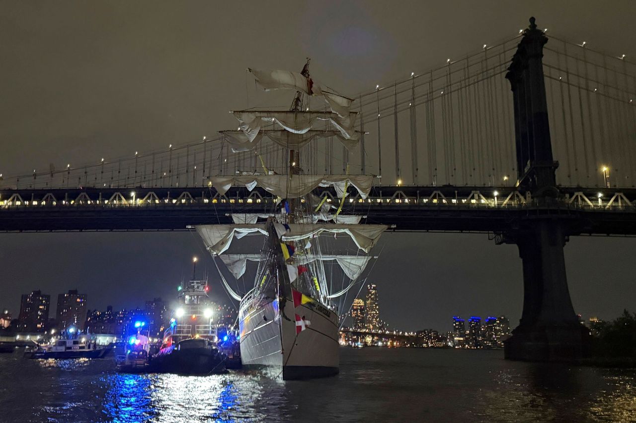 A Mexican navy ship sits in the water after it hit the Brooklyn Bridge in New York, on Saturday.