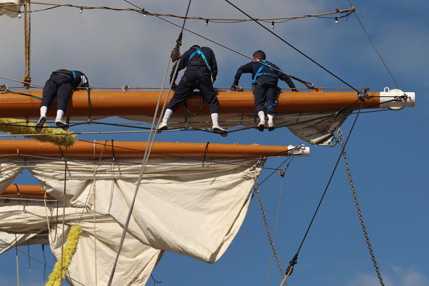 Sailors work Sunday on the yard arms of the Cuauhtémoc in New York.