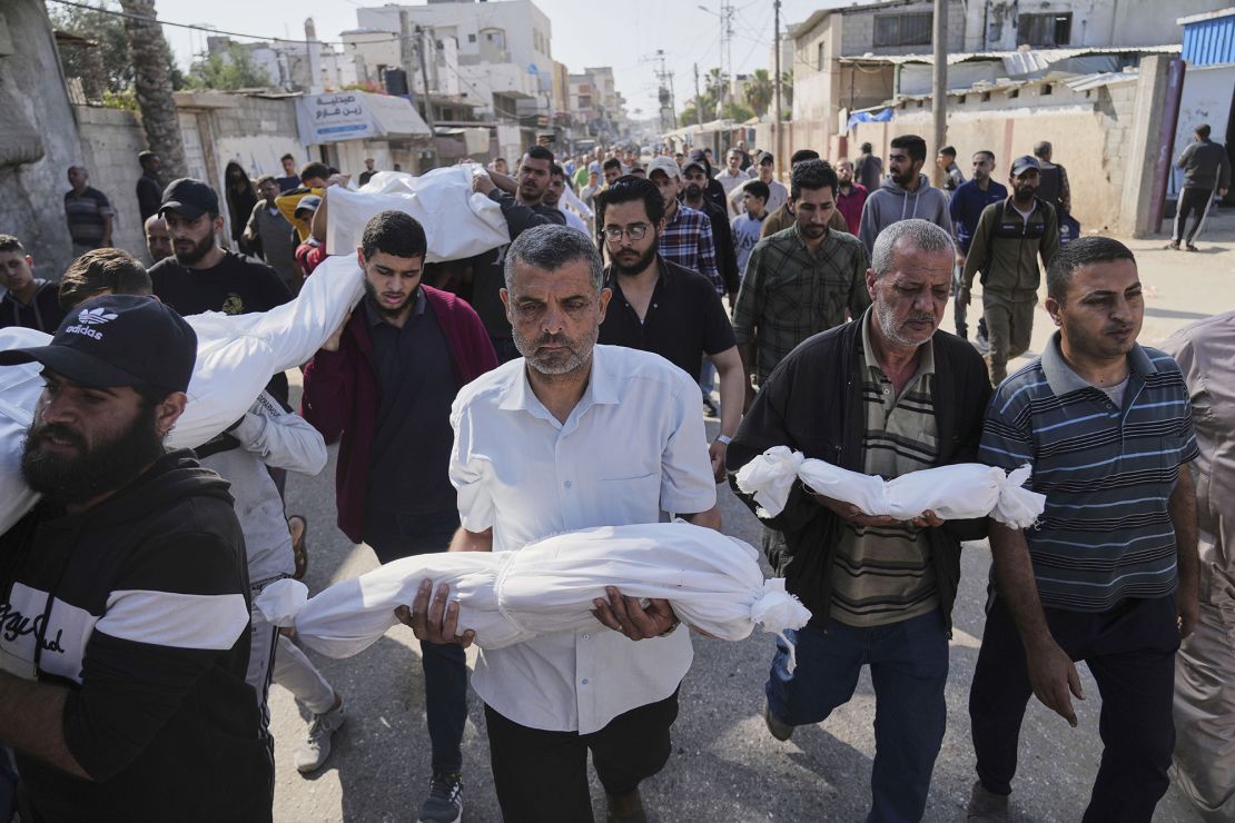 Palestinian carry the bodies of their relatives including children who were killed in an Israeli army airstrike in Deir al-Balah, Gaza, on Wednesday.