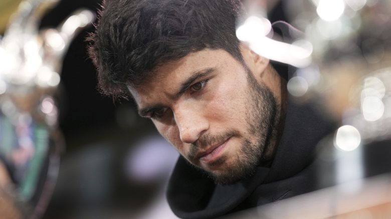 Titleholder Carlos Alcaraz, of Spain, looks at the cups during the draw of French Open tennis tournament, Thursday, May 22, 2025 at the Roland Garros stadium in Paris.