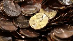 Freshly-made pennies sit in a bin at the US Mint in Denver in this 2007 file photo.