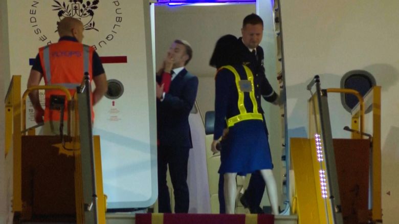 In this grab taken from video, France's President Emmanuel Macron prepares to disembark a plane on arrival, in Hanoi, Vietnam, Sunday, May 25, 2025. (AP Photo/Hau Dinh)