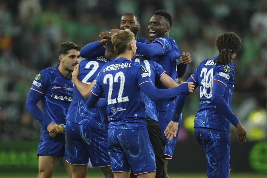 Chelsea players celebrate after sealing a win in the Conference League final.