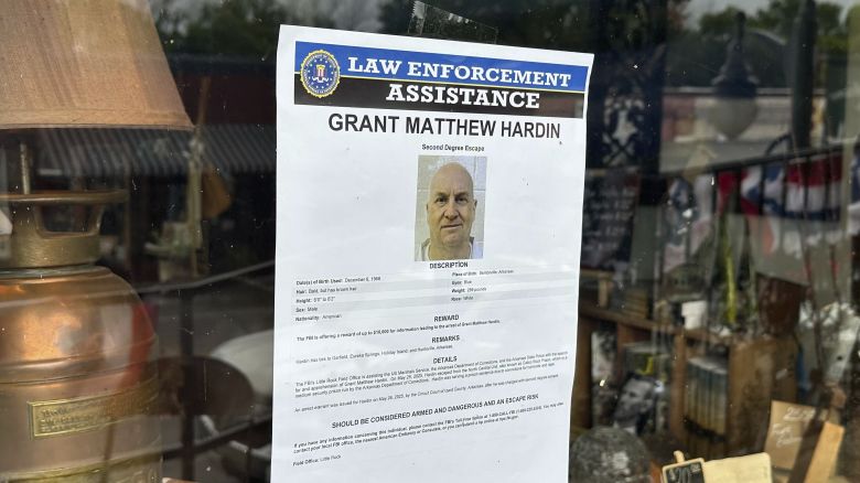 A flier looking for Grant Hardin hangs on the glass of a business, Thursday, May 29, 2025, in downtown Calico Rockt, Arkansas.