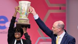 E.W. Scripps Company president and CEO Adam Symson presents the trophy to Faizan Zaki, 13, of Dallas, the winner of the 2025 Scripps National Spelling Bee, Thursday, May 29, 2025, in Oxon Hill, Md. (AP Photo/Julia Demaree Nikhinson)
