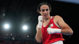 Imane Khelif poses after winning gold in the Women's 66kg Final boxing match in the 2024 Summer Olympics.