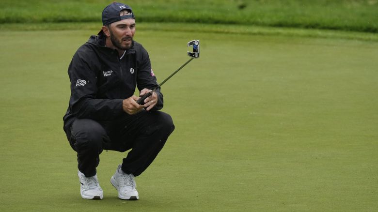 Max Homa lines up his putt on the 13th green during the second round of the Memorial golf tournament, Friday, May 30, 2025, in Dublin, Ohio. (AP Photo/Sue Ogrocki)