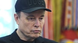 Elon Musk attends a news conference with President Donald Trump in the Oval Office in May. Even since leaving the Trump administration, Musk's attention isn't fully on Tesla.