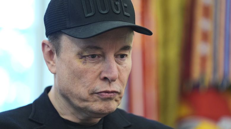 Elon Musk attends a news conference with President Donald Trump in the Oval Office in May. Even since leaving the Trump administration, Musk's attention isn't fully on Tesla.