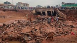 People search in flooded area following a downpour in Mokwa, Nigeria, on Friday, May 30, 2025.