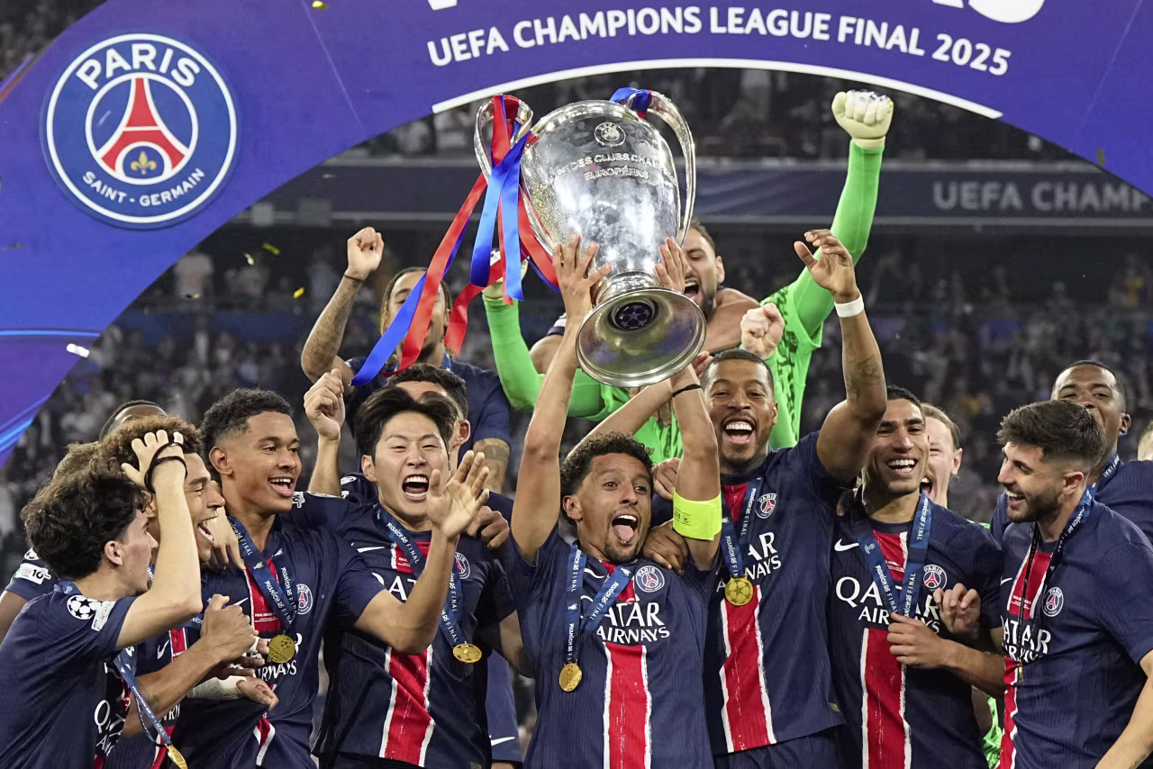 PSG captain Marquinhos lifts up the trophy during the postmatch celebrations.