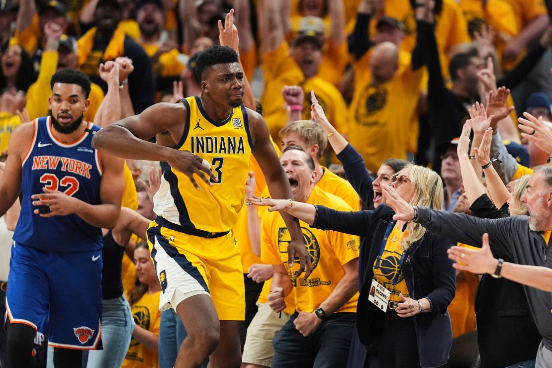 Indiana Pacers center Thomas Bryant celebrates after making a 3-pointer during the second half of Game 6 of the Eastern Conference finals.