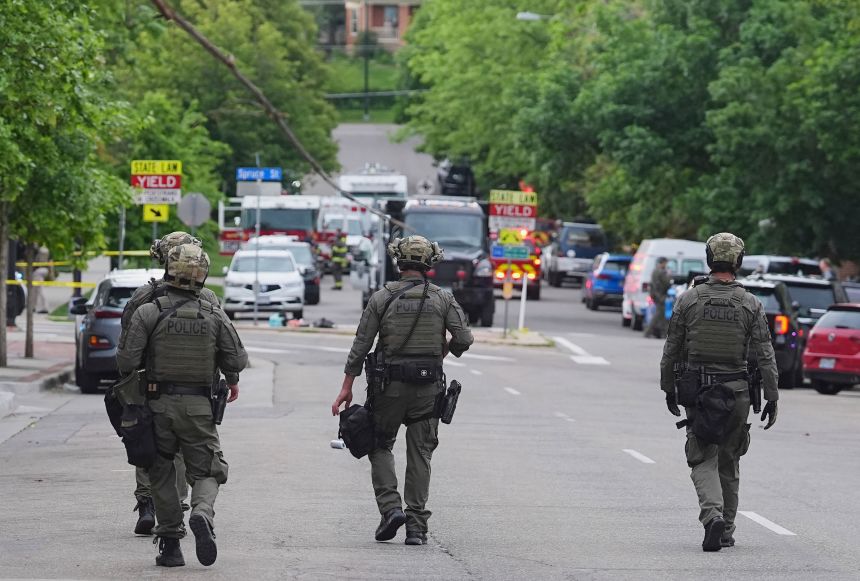 Law enforcement officials investigate after the attack on a peaceful demonstration for Israeli hostages in Boulder.