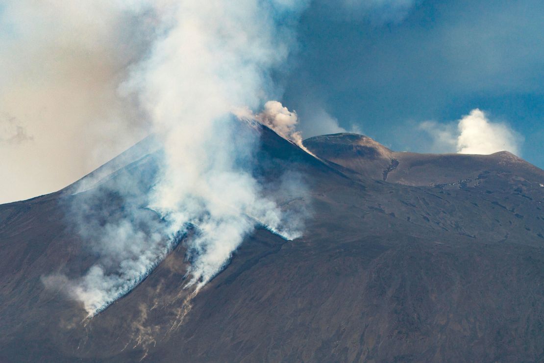 Smoke billows from Mt.Etna as tourists fled its latest eruption.
