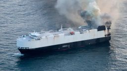 In this photo provided by the U.S. Coast Guard, smoke rises from cargo vessel Morning Midas approximately 300 miles south of Adak, Alaska, June 3, 2025, as the crew of a cargo ship carrying around 3,000 vehicles to Mexico, abandoned ship after they could not control a fire. (U.S. Coast Guard/Courtesy Air Station Kodiak via AP)