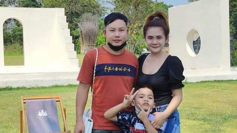 This undated photo provided by the Hostage's Family Forum shows Nattapong Pinta, with his wife and son.