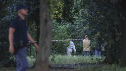 FILE -- A police officer walks past a sealed-off area where forensic police work at the site of the discovery of the body of an infant and the infant’s mother, in Rome’s Villa Pamphili park, Saturday, June 7, 2025. (Francesco Benvenuti/LaPresse via AP)