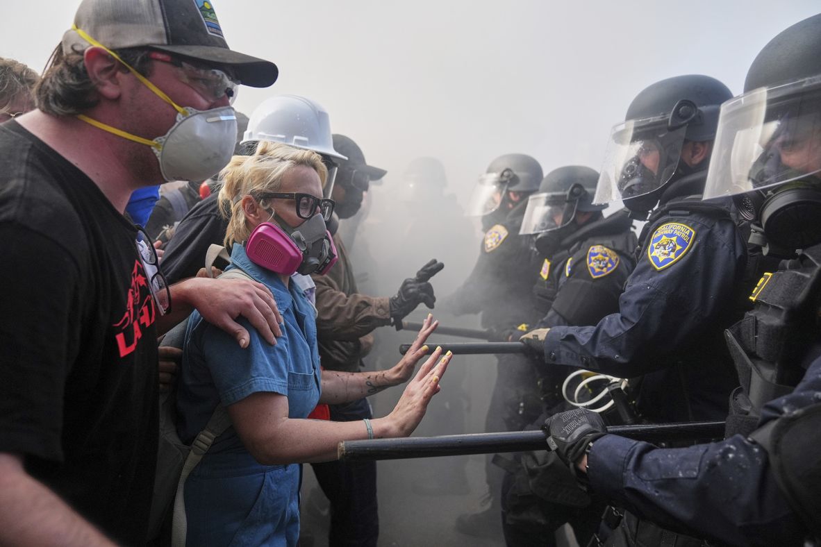 Protesters confront police on the 101 Freeway near the Metropolitan Detention Center on Sunday, June 8.