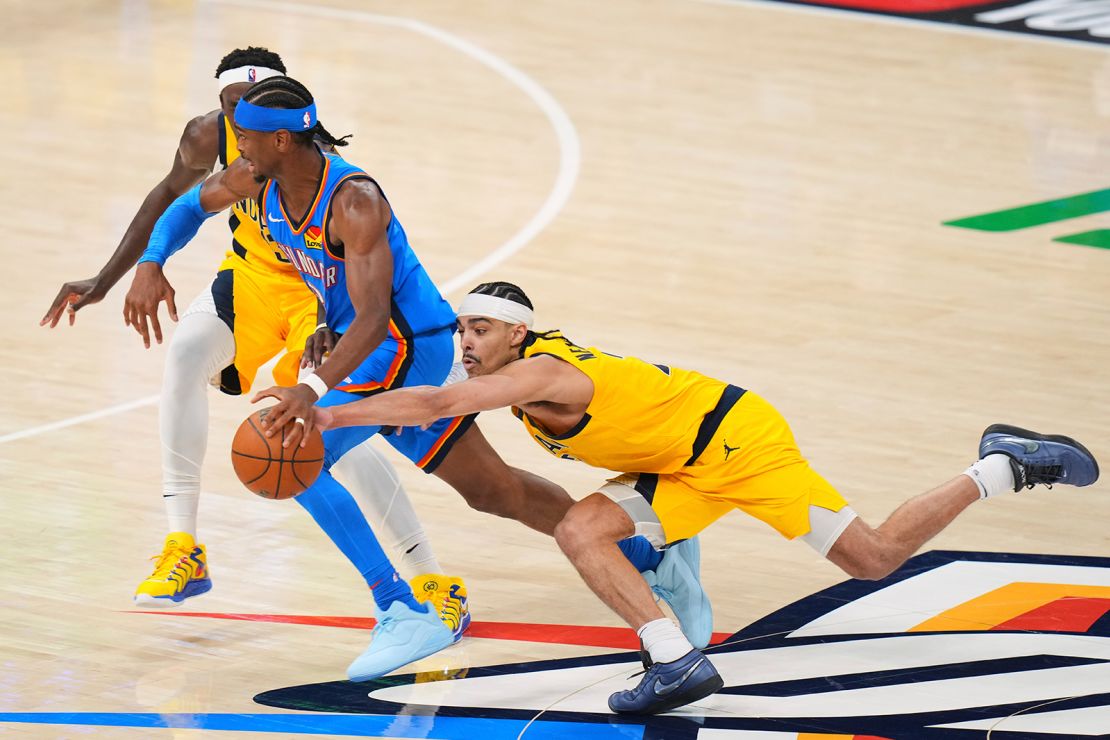 Oklahoma City Thunder guard Shai Gilgeous-Alexander faces a double-team during the first half of Game 2.