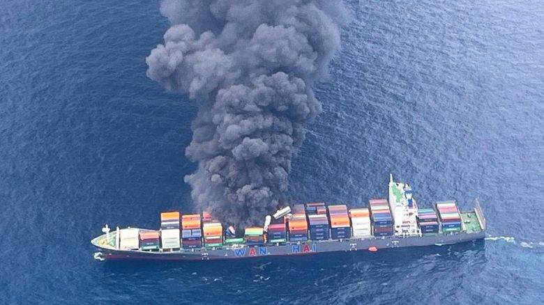 In this photo released by Indian Coast Guard, smoke rises following an explosion and fire onboard a Singapore-flagged container ship off the coast of Kerala, India, Monday, June 9, 2025. (Indian Coast Guard via AP)