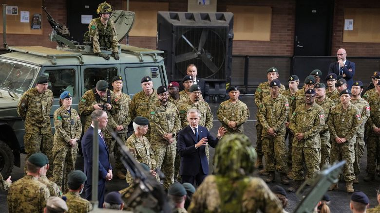 Canada Prime Minister Mark Carney speaks to service personnel after making an announcement as he visits Fort York Armoury in Toronto, Canada, on Monday, June 9, 2025.