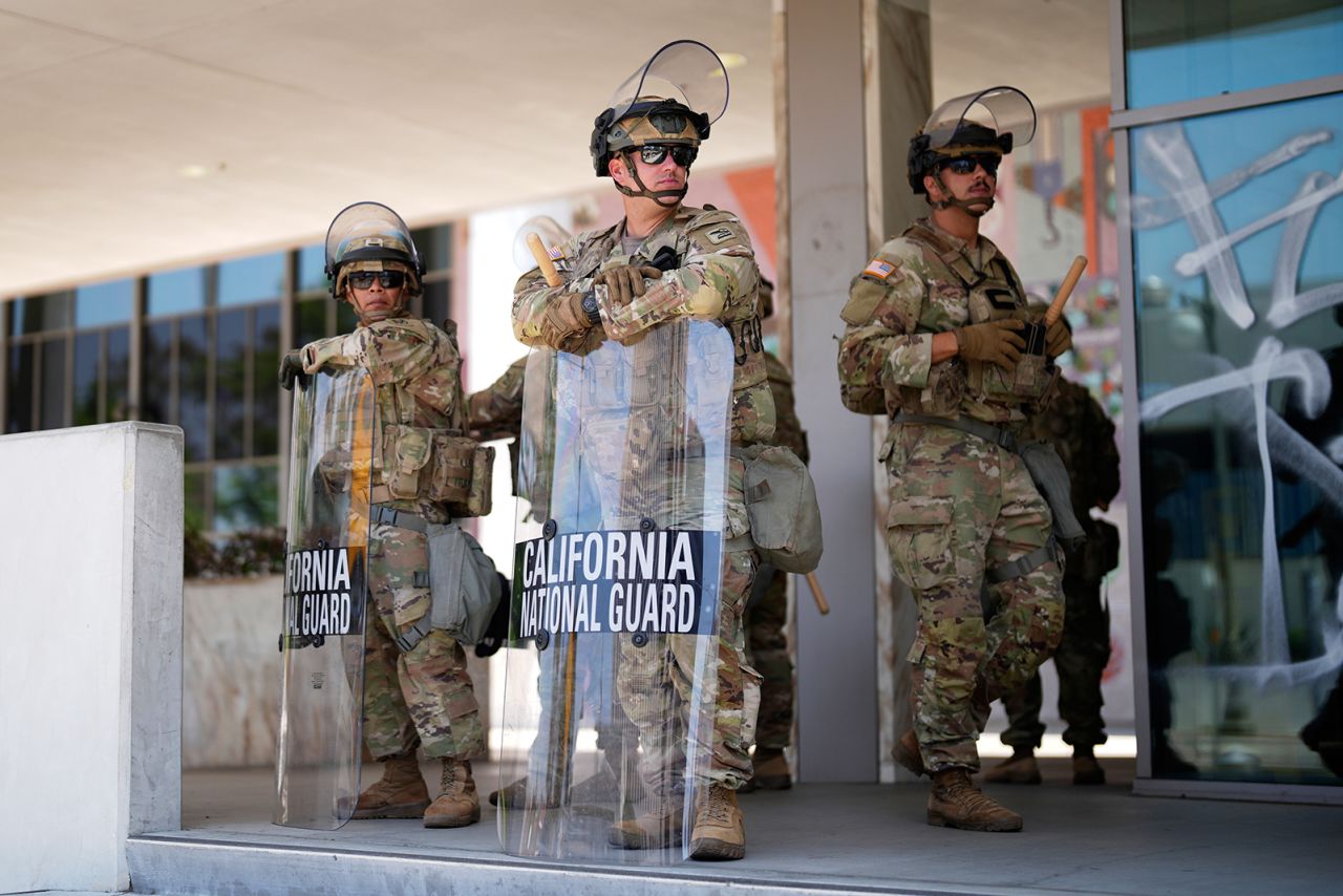 National Guard stand guard near the metropolitan detention center on Monday, in downtown Los Angeles.
