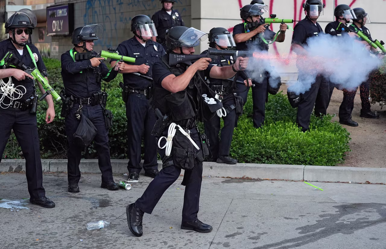 Los Angeles police department personnel fire non-lethal rounds at protesters on Monday, June 9, 2025, in downtown Los Angeles. (AP Photo Jae Hong)