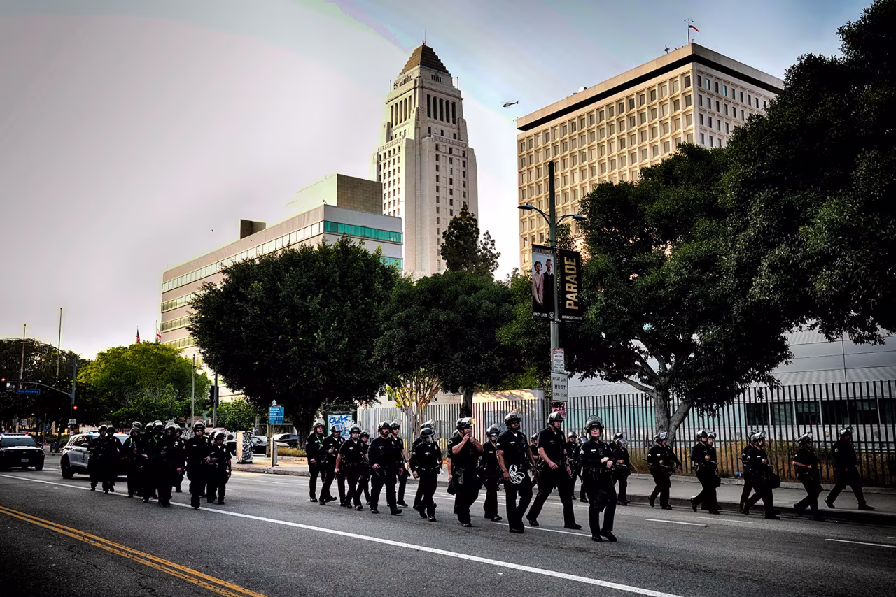A Los Angeles police officers clear a street near Los Angeles City Hall in downtown Los Angeles on Monday.