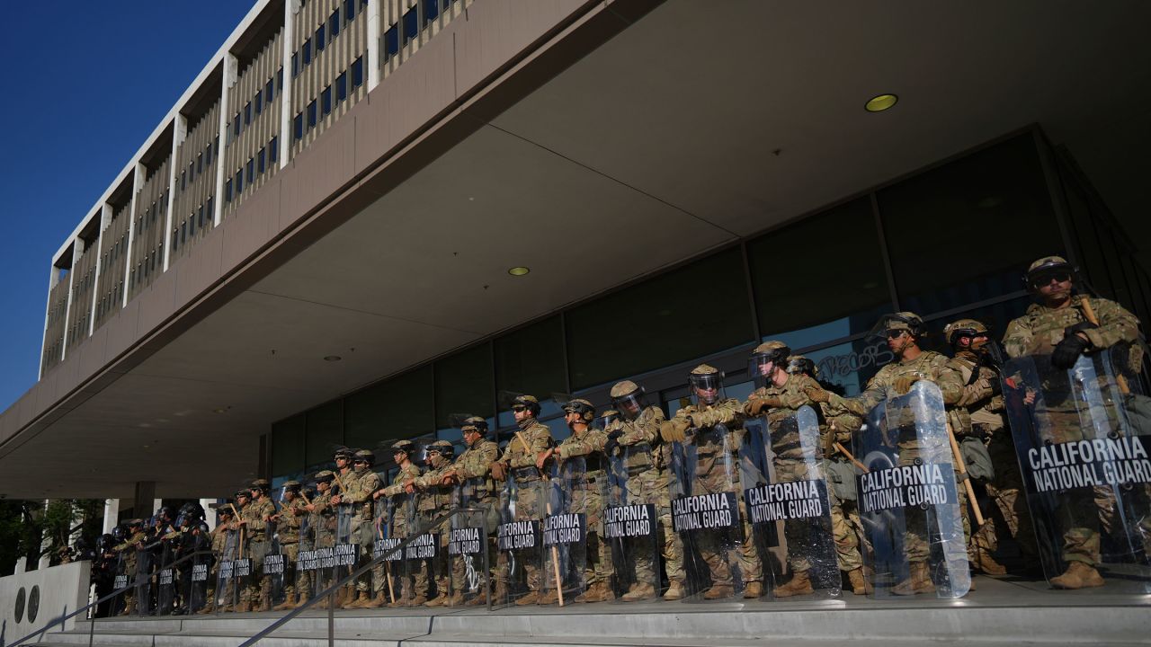 California National Guard stand in formation guarding the federal building in downtown Los Angeles on Tuesday, June 10, 2025. (AP Photo/Eric Thayer)