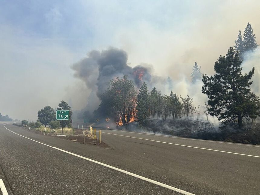 The Rowena Fire burns near Interstate 84 in northern Oregon on Wednesday.