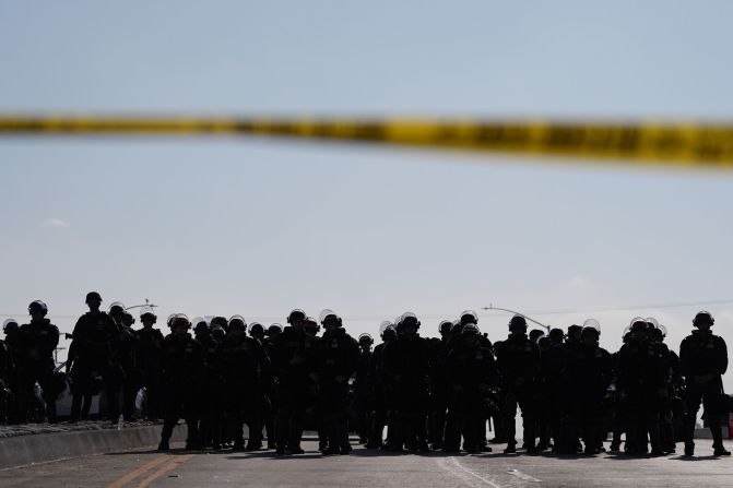 Law enforcement blocks a road during a protest in Paramount, California, on Wednesday.