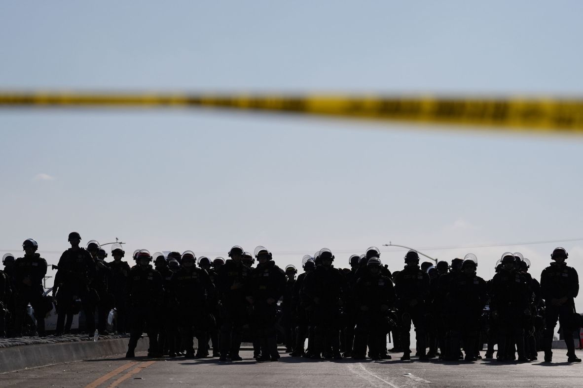 Law enforcement blocks a road during a protest in Paramount, California, on Wednesday.