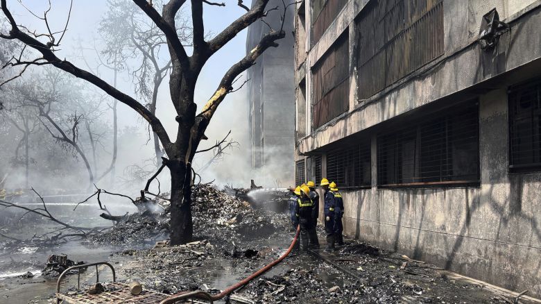 Firefighters work at the site of an airplane that crashed in India's northwestern city of Ahmedabad in Gujarat state, Thursday, June12, 2025. (AP Photo/Ajit Solanki)