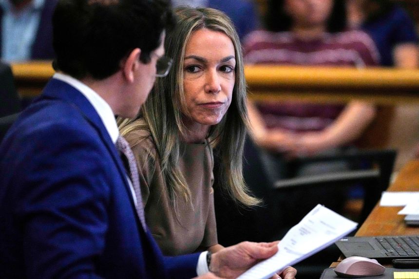 Karen Read talks with her attorney, Robert Alessi, during her trial at Norfolk Superior Court, Thursday, June 12, in Dedham, Massachusetts.