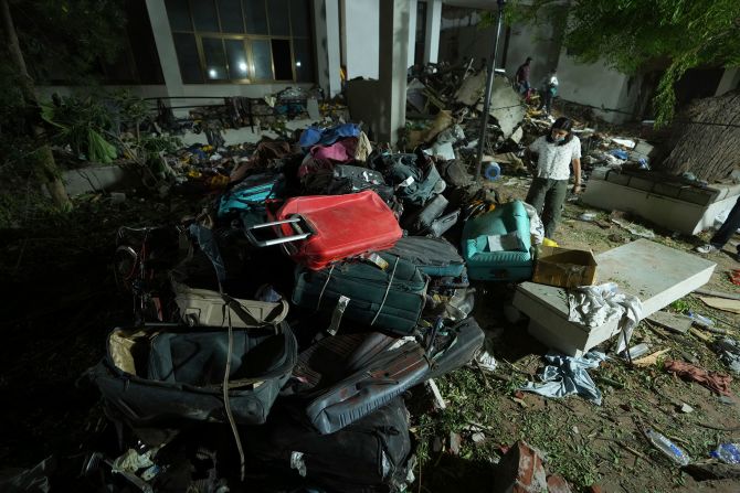 Search-and-recovery teams work through the rubble on Thursday evening.