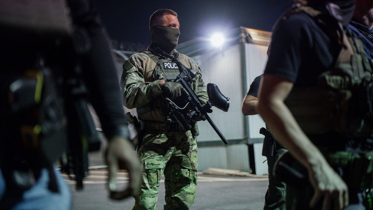Immigration enforcement agents guard outside the Delaney Hall Detention Facility during a protest over federal immigration enforcement raids in Newark, New Jersey on June 12, 2025.