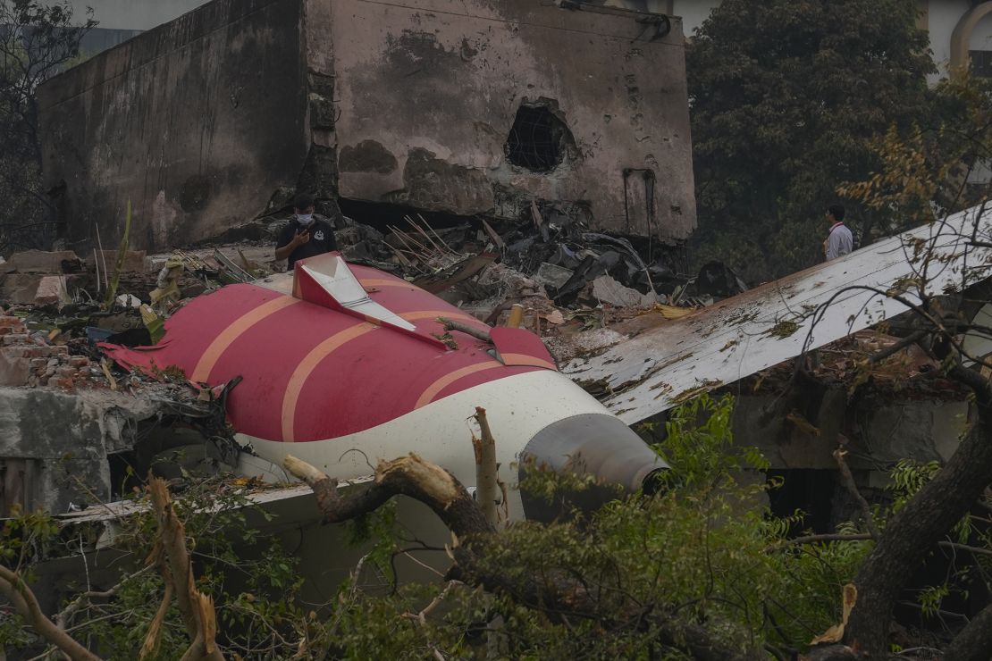 Parts of the Air India plane are seen on top of a building in Ahmedabad, India, Friday, June 13, 2025.