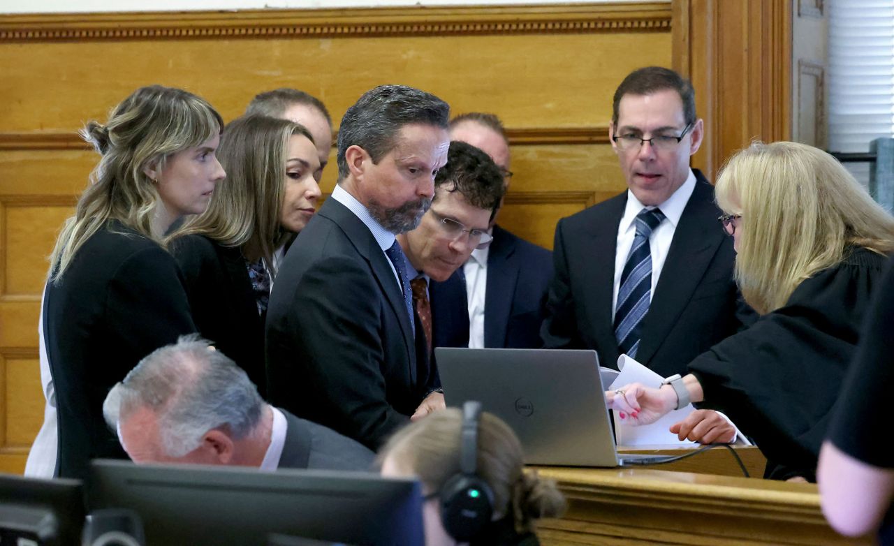 Defendant Karen Read, second from left, defense attorneys and prosecutors meet at side bar with Judge Beverly Cannone, right, before closing arguments on June 13 in Dedham, Massachusetts.