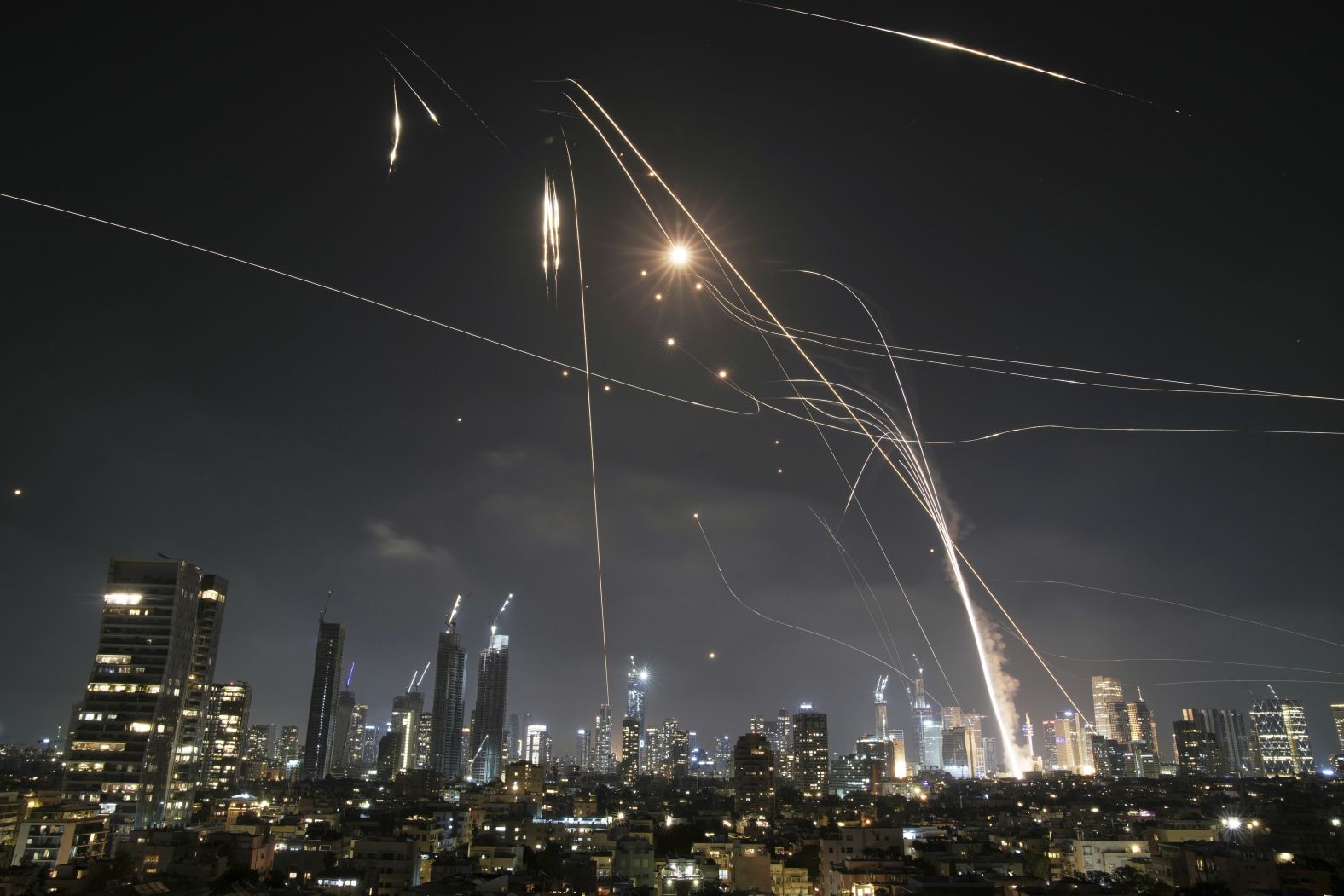 Israel's Iron Dome defense system is used to intercept missiles over Tel Aviv as Iran began retaliatory strikes on Friday night.