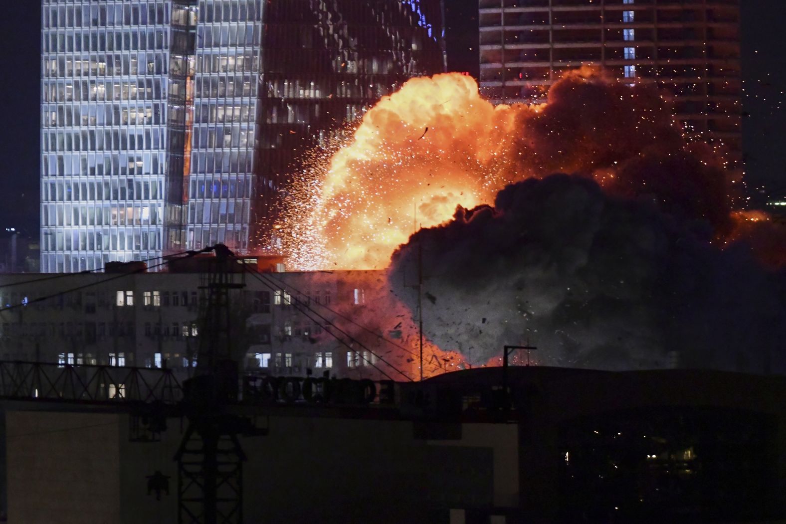 An explosion is seen during a retaliatory attack in Tel Aviv, Israel, on Friday, June 13.