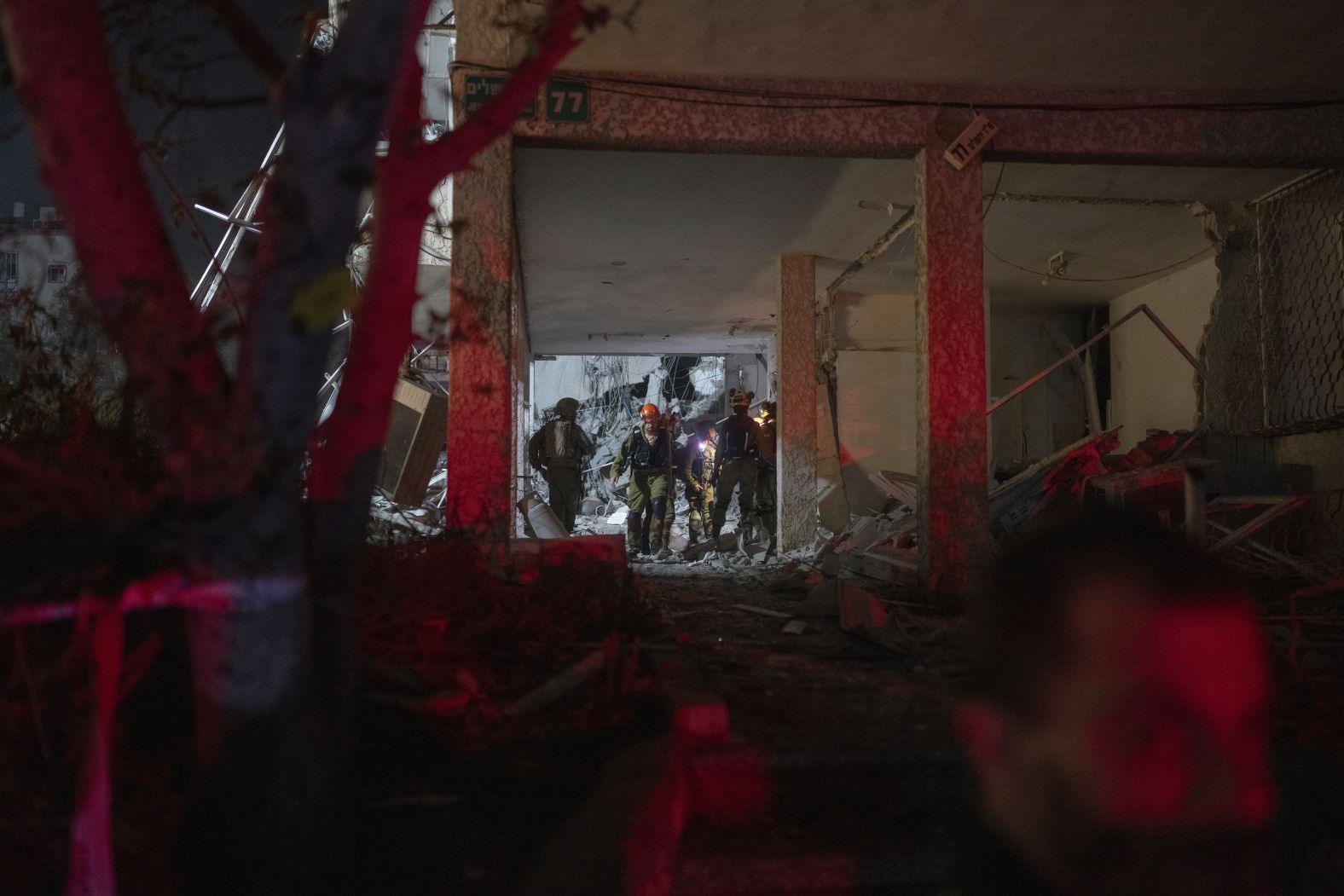 Firefighters inspect the aftermath of a strike in Ramat Gan, Israel.