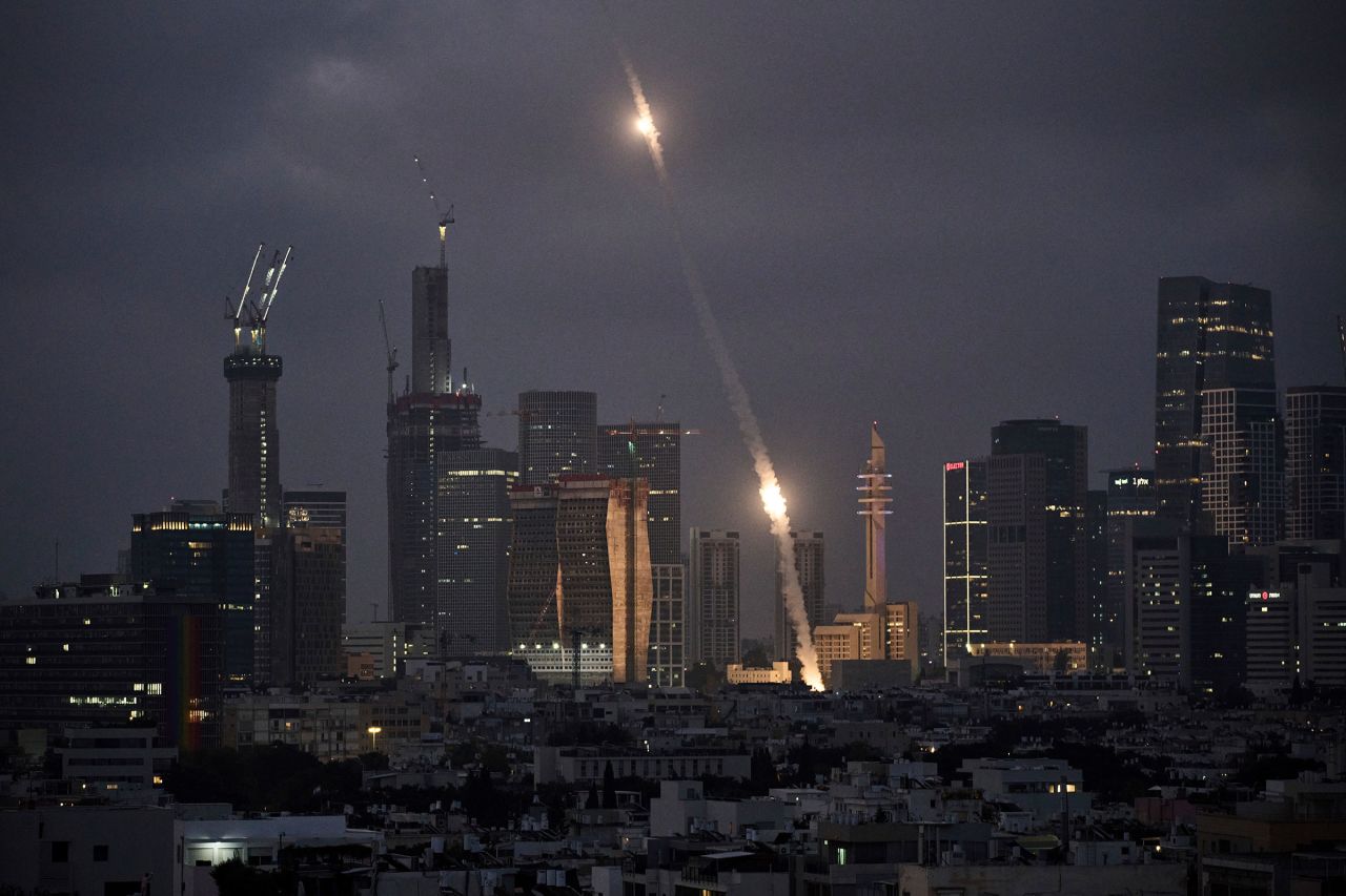 Israel's Iron Dome air defense system fires to intercept projectiles over Tel Aviv on Saturday.