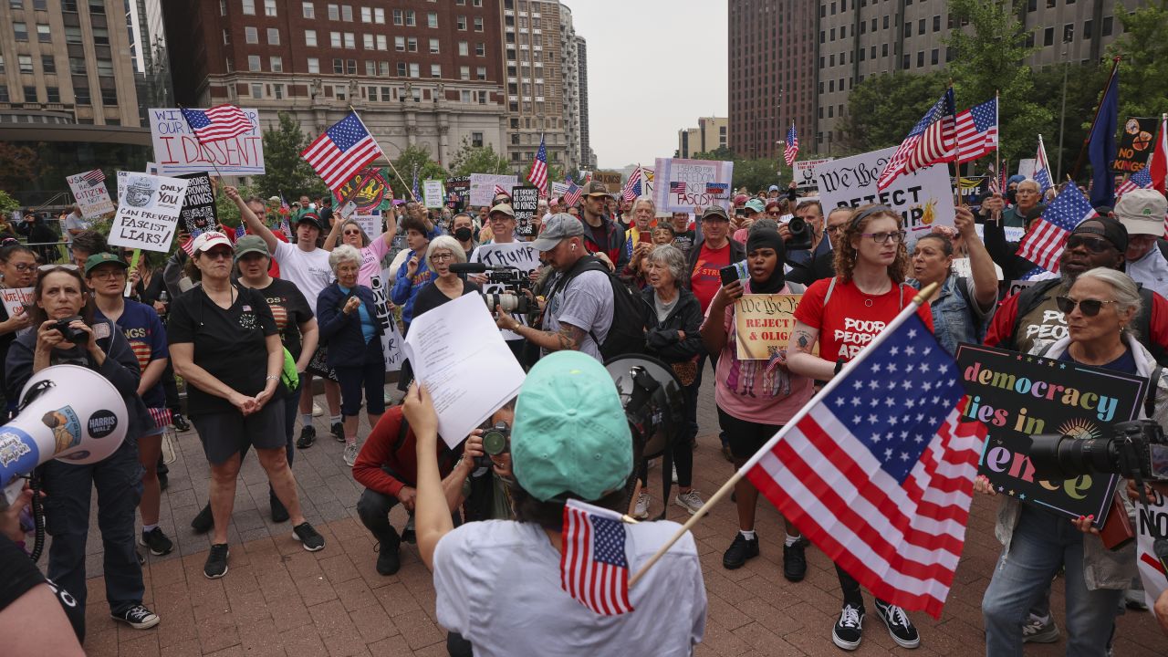 An organizer leads protestors in a chant during the "No Kings" protest, Saturday, June 14, 2025, in Philadelphia. (AP Photo/Yuki Iwamura)