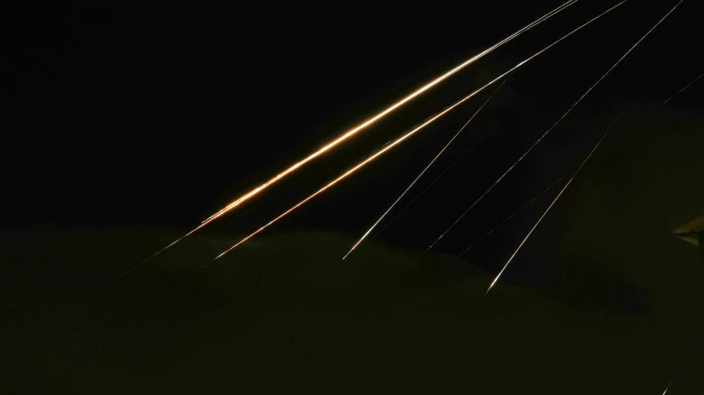 Traces of projectile illuminates the sky seen from northern Israel, Saturday, June 14, 2025. (AP Photo/Ariel Schalit)