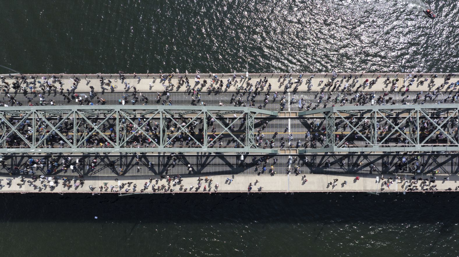 Demonstrators in Portland, Oregon, cross the Hawthorne Bridge.