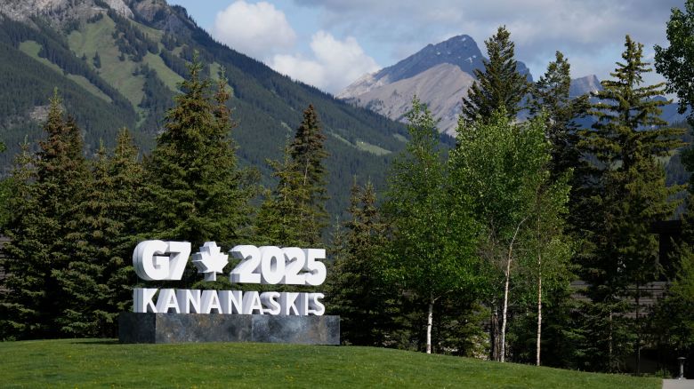 Mountains provide the backdrop to a G7 sign in Banff, Alberta, on Sunday, ahead of the G7 Summit.