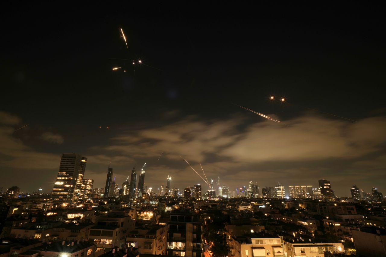 Israel's Iron Dome air defense system fires to intercept missiles over Tel Aviv, Israel on Sunday.