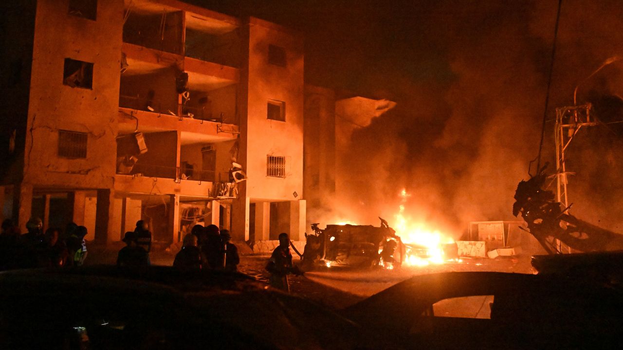 Firefighters work to extinguish a blaze after a missile launched from Iran struck Haifa, in northern Israel, on Sunday, June 15, 2025. (AP Photo/Rami Shlush)