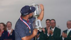 J.J. Spaun celebrates with the trophy after winning the U.S. Open golf tournament at Oakmont Country Club Sunday, June 15, 2025, in Oakmont, Pa. (AP Photo/Seth Wenig)