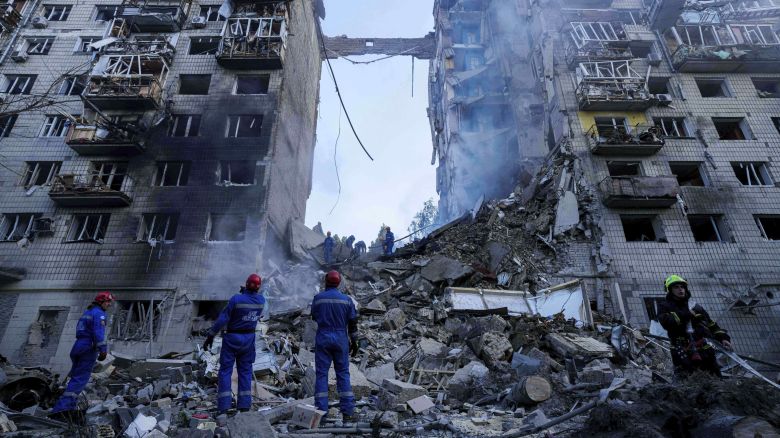 Rescue workers clear the rubble of a multi-storey residential house destroyed by a Russian strike in Kyiv, Ukraine, on June 17, 2025.